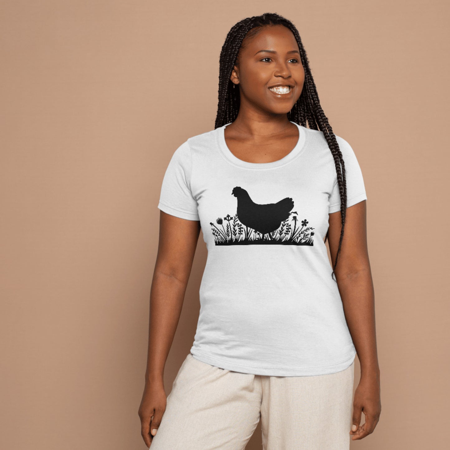 Charming chicken silhouette in lush grass and blooms