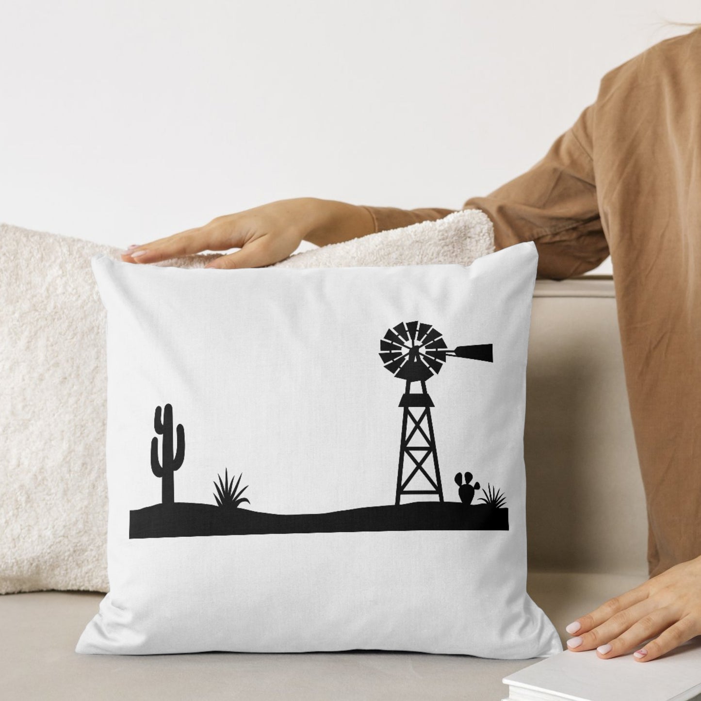 Desert scene with a silhouetted windmill