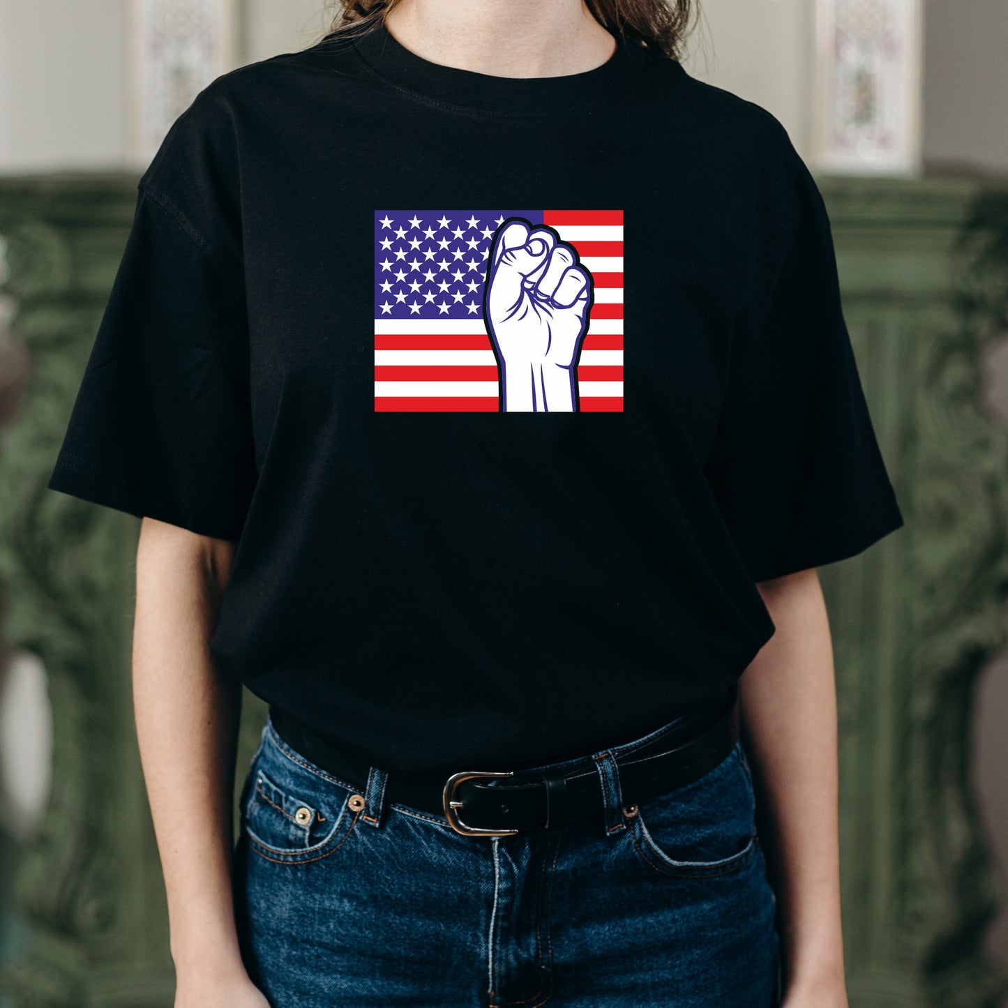 Fist raised against the backdrop of a patriotic American flag
