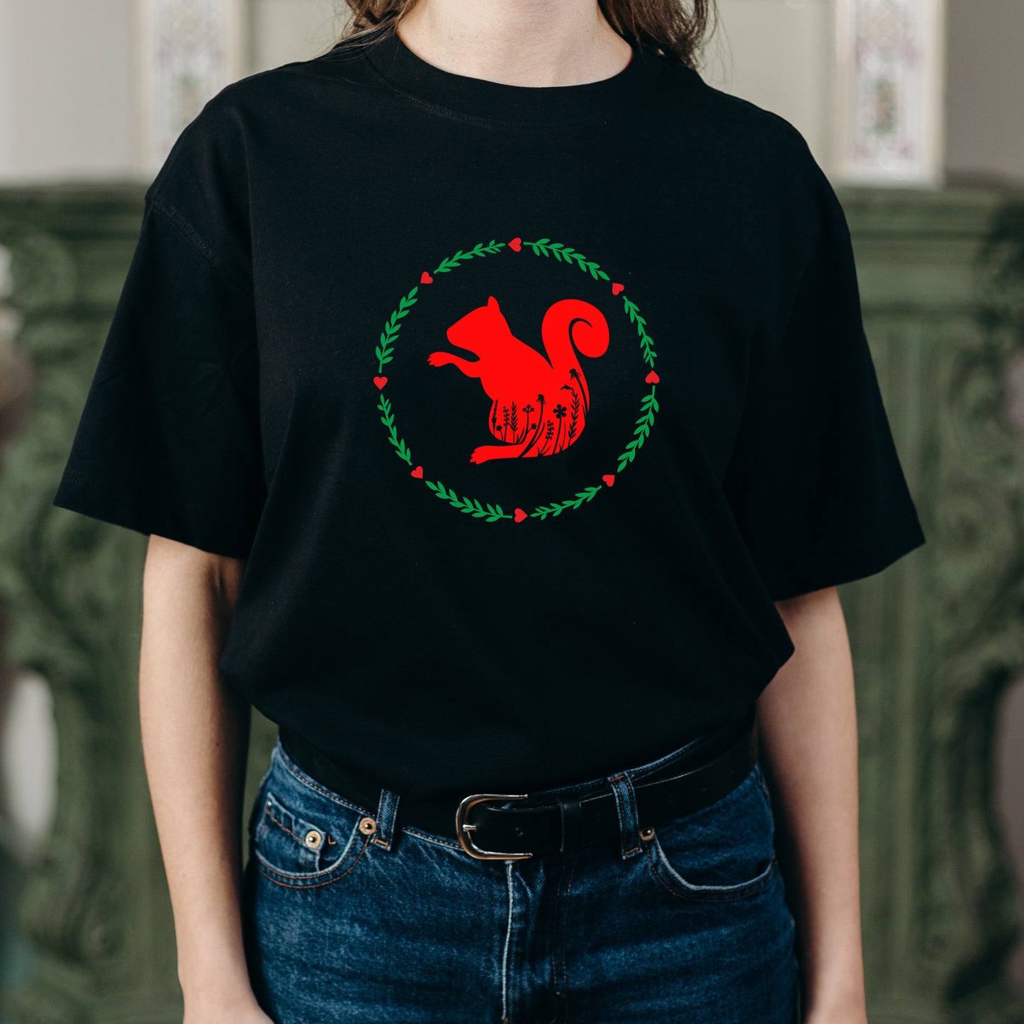 Floral design featuring a whimsical silhouette of a squirrel