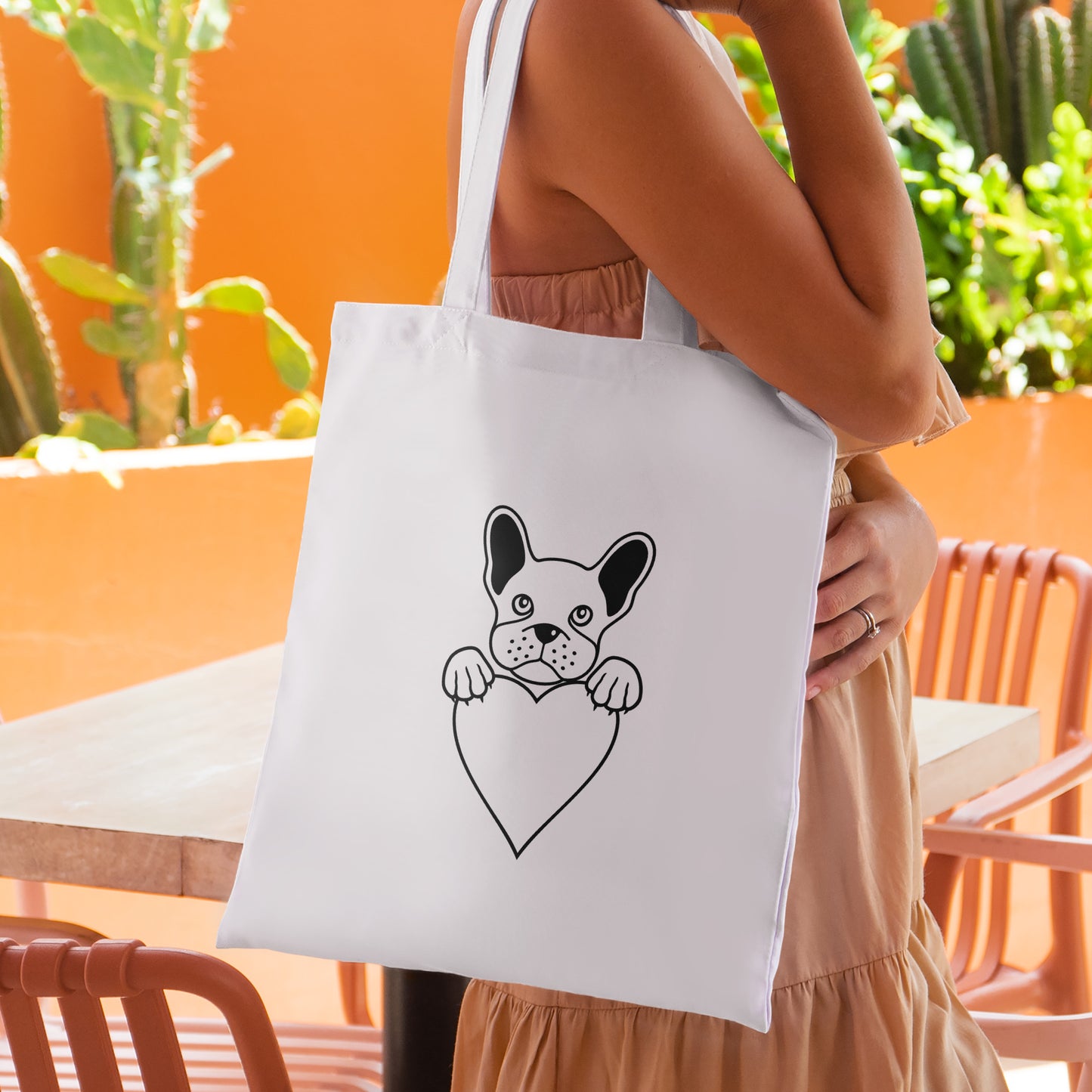 Cute French bulldog holding a heart vector design for crafting