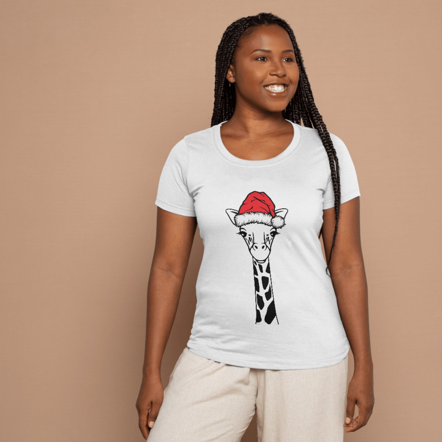 Giraffe wearing a festive santa hat for holiday cheer