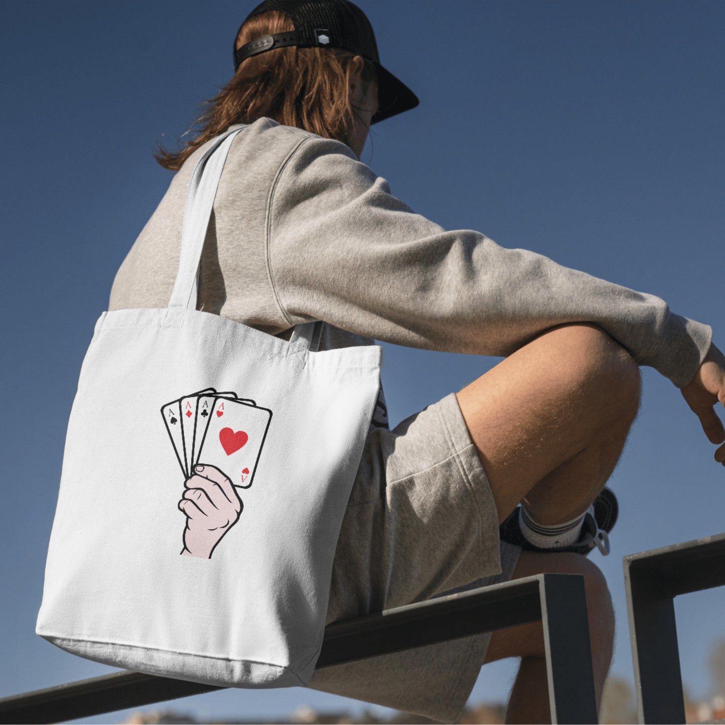 Playing cards held high with excitement for game lovers
