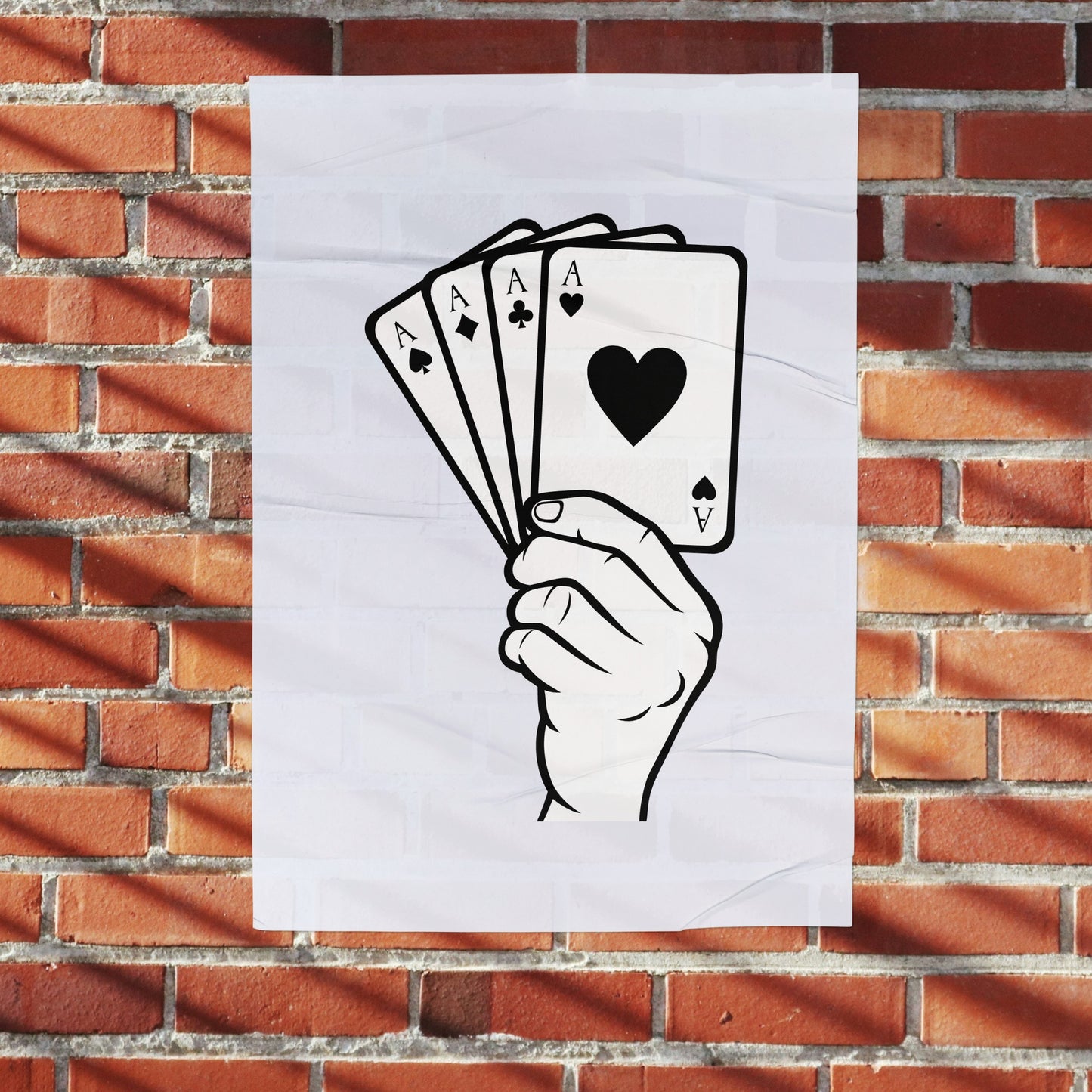 Creative hand holds four playing cards for fun activity