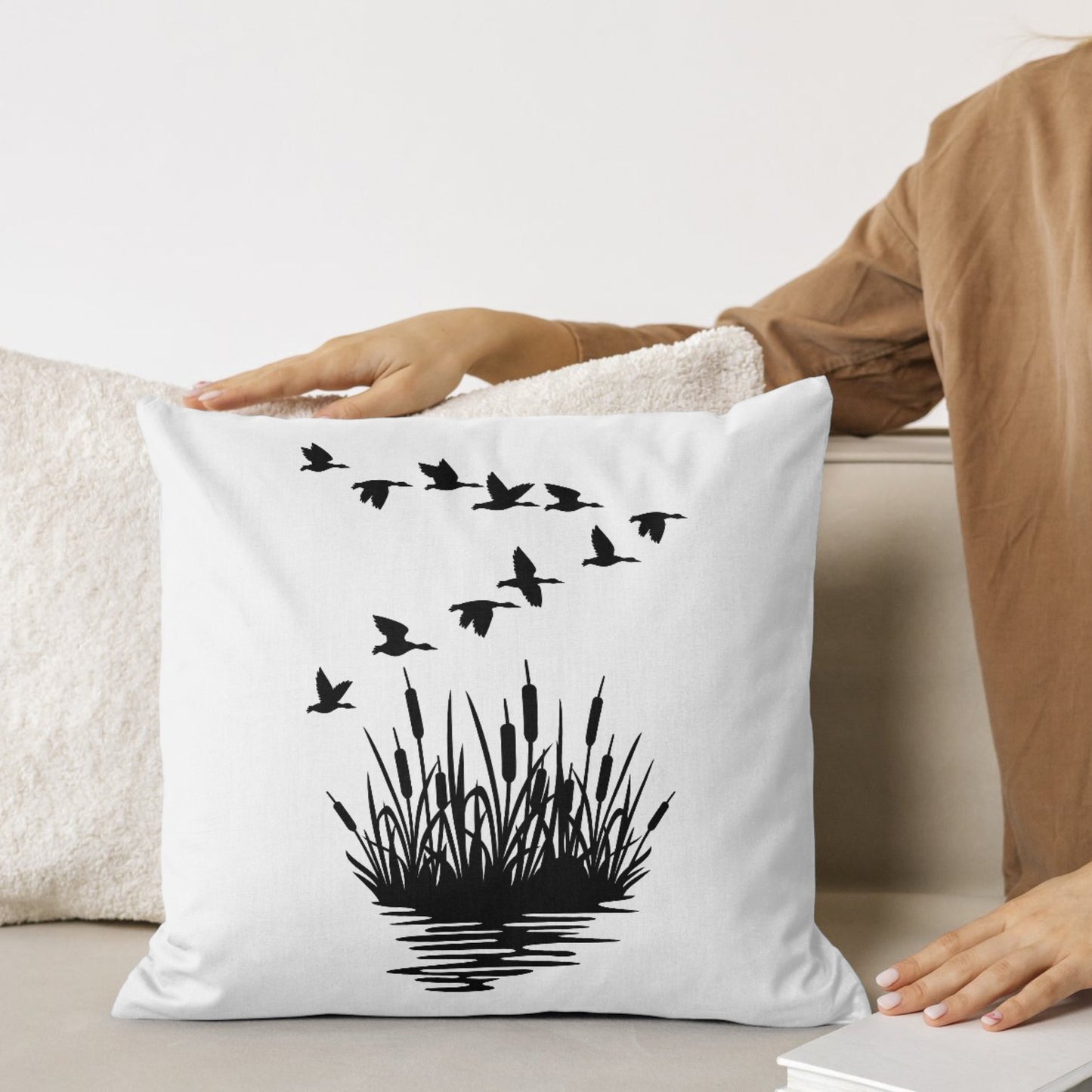 Elegant mallard ducks in flight above lush reeds