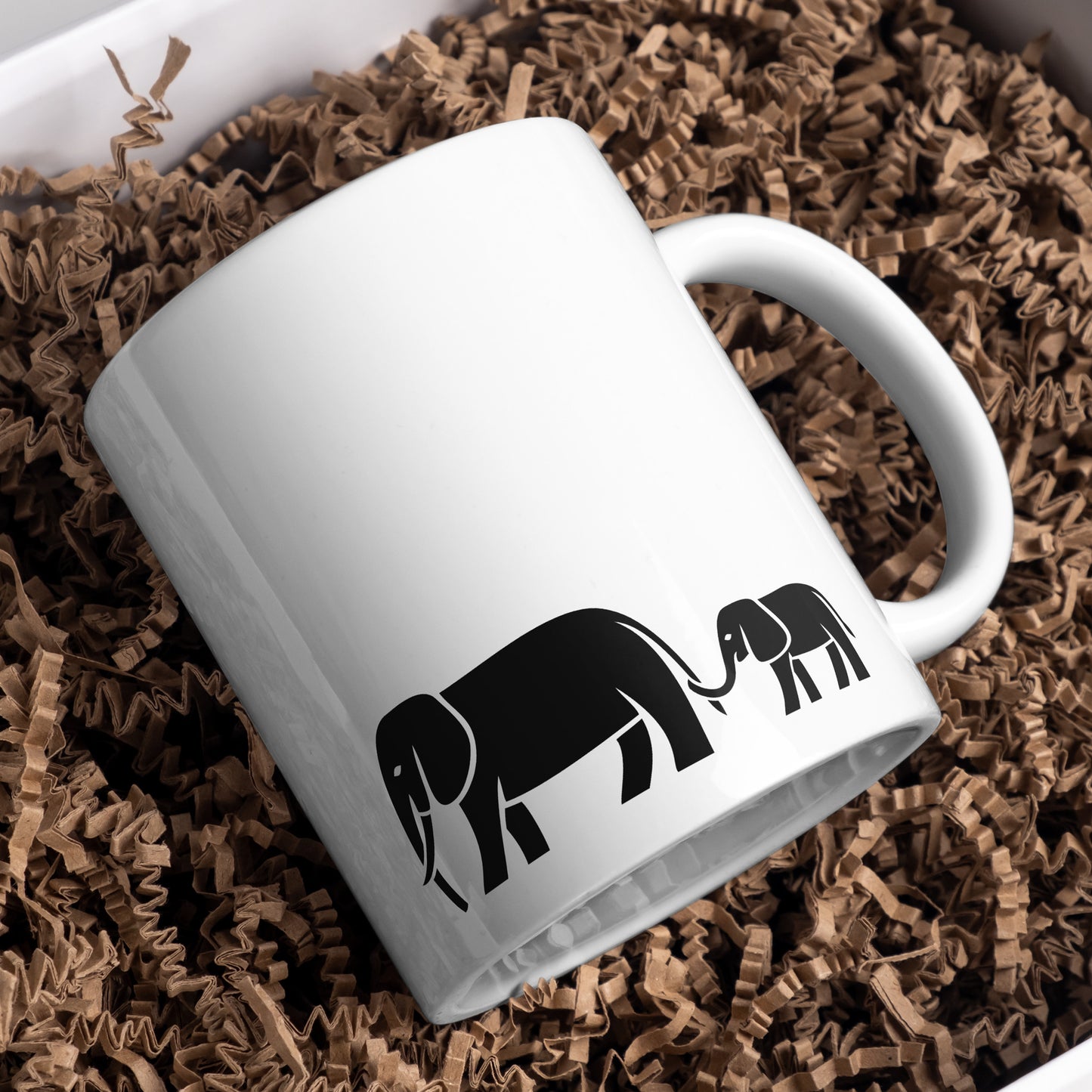 Mom and baby elephants walking together in a joyful moment
