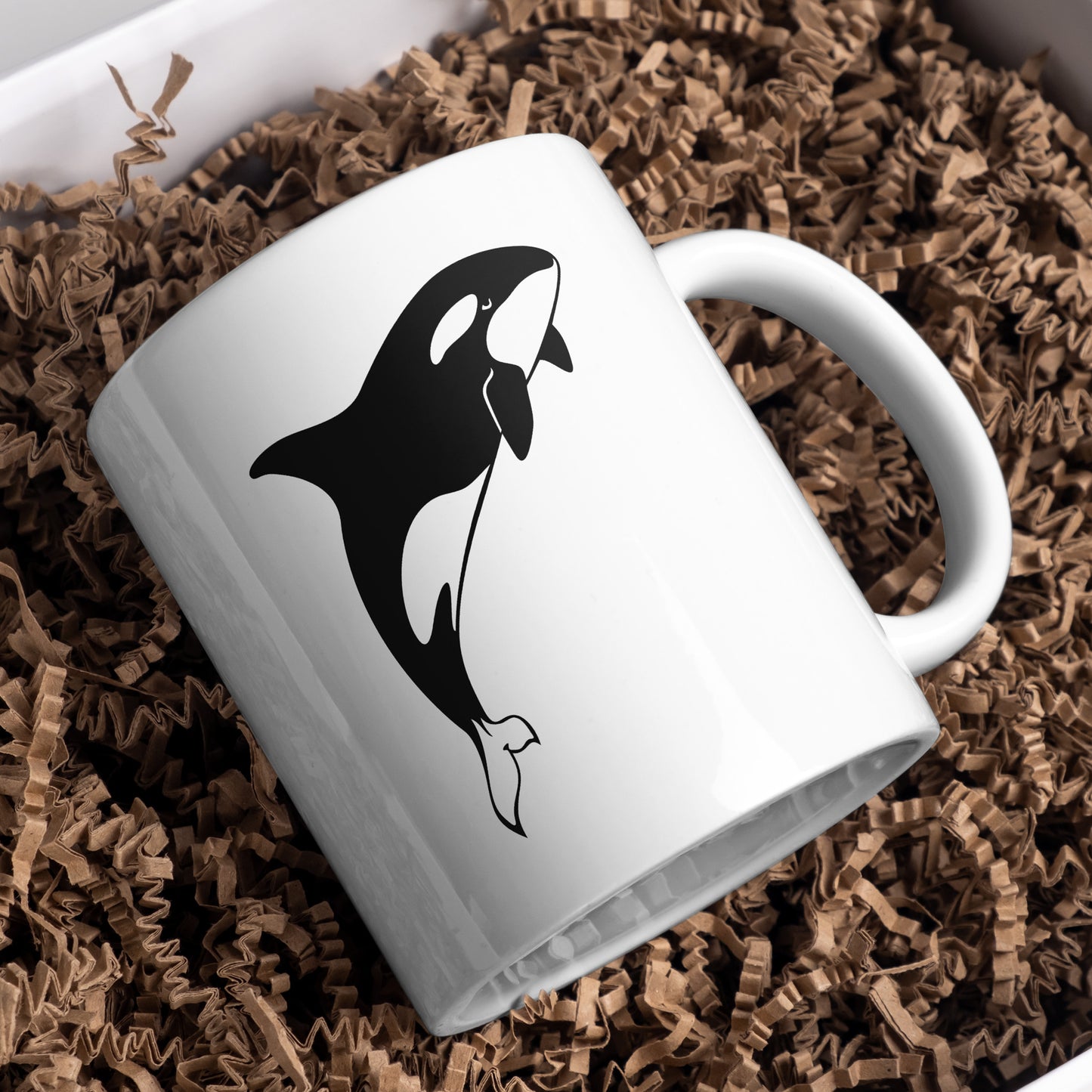 Design with a playful black and white orca shape