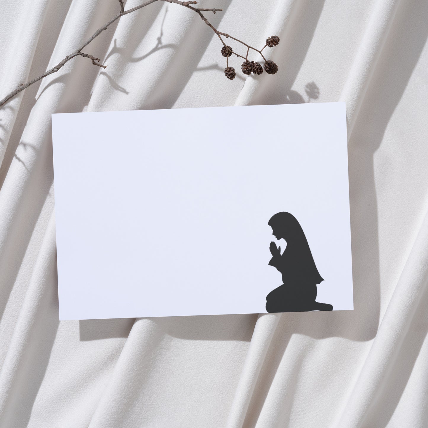 Elegant silhouette of a praying woman for creative projects