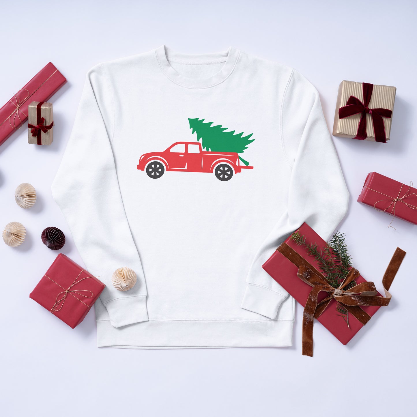Red pickup truck with Christmas tree for the holidays