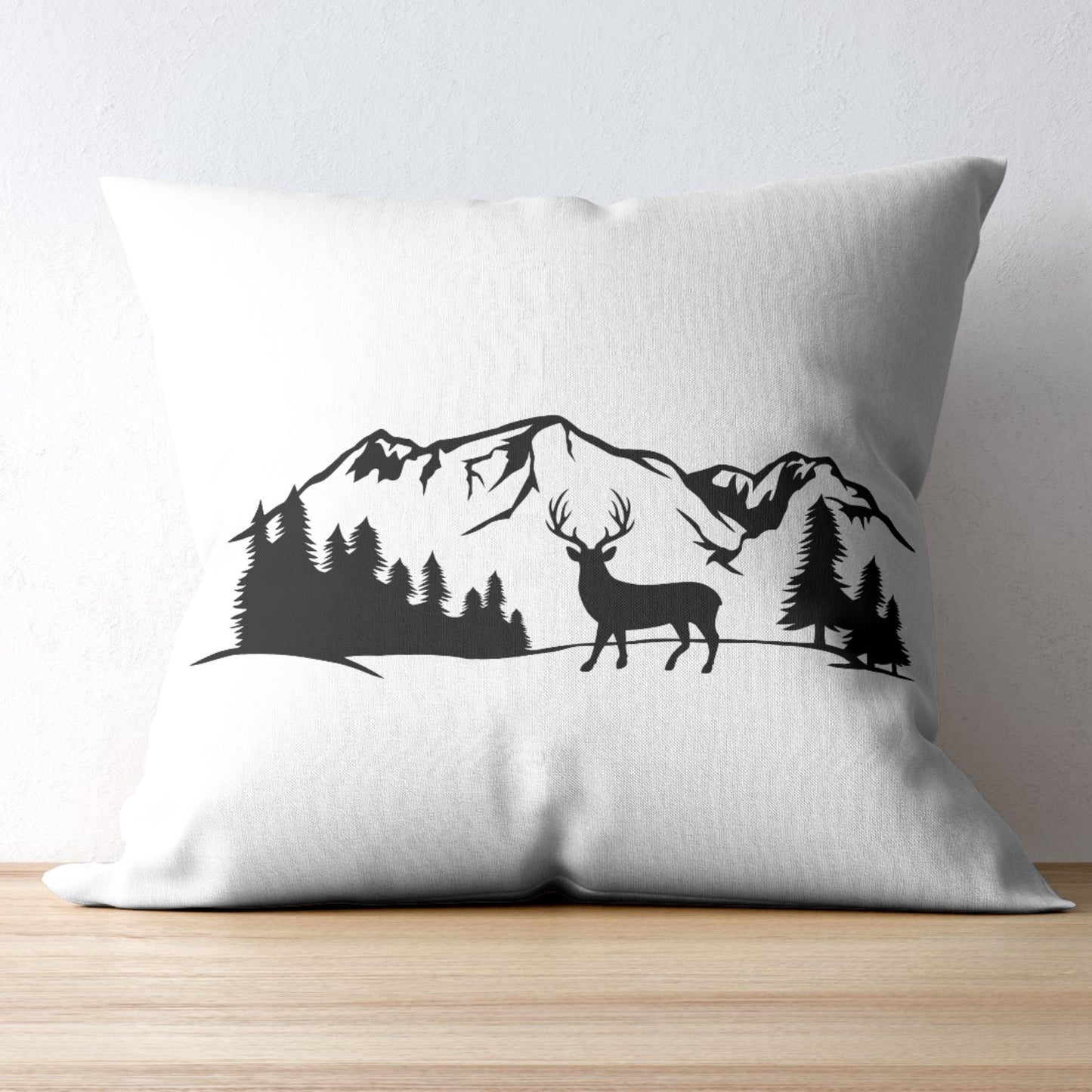 Majestic deer silhouette against serene mountain backdrop