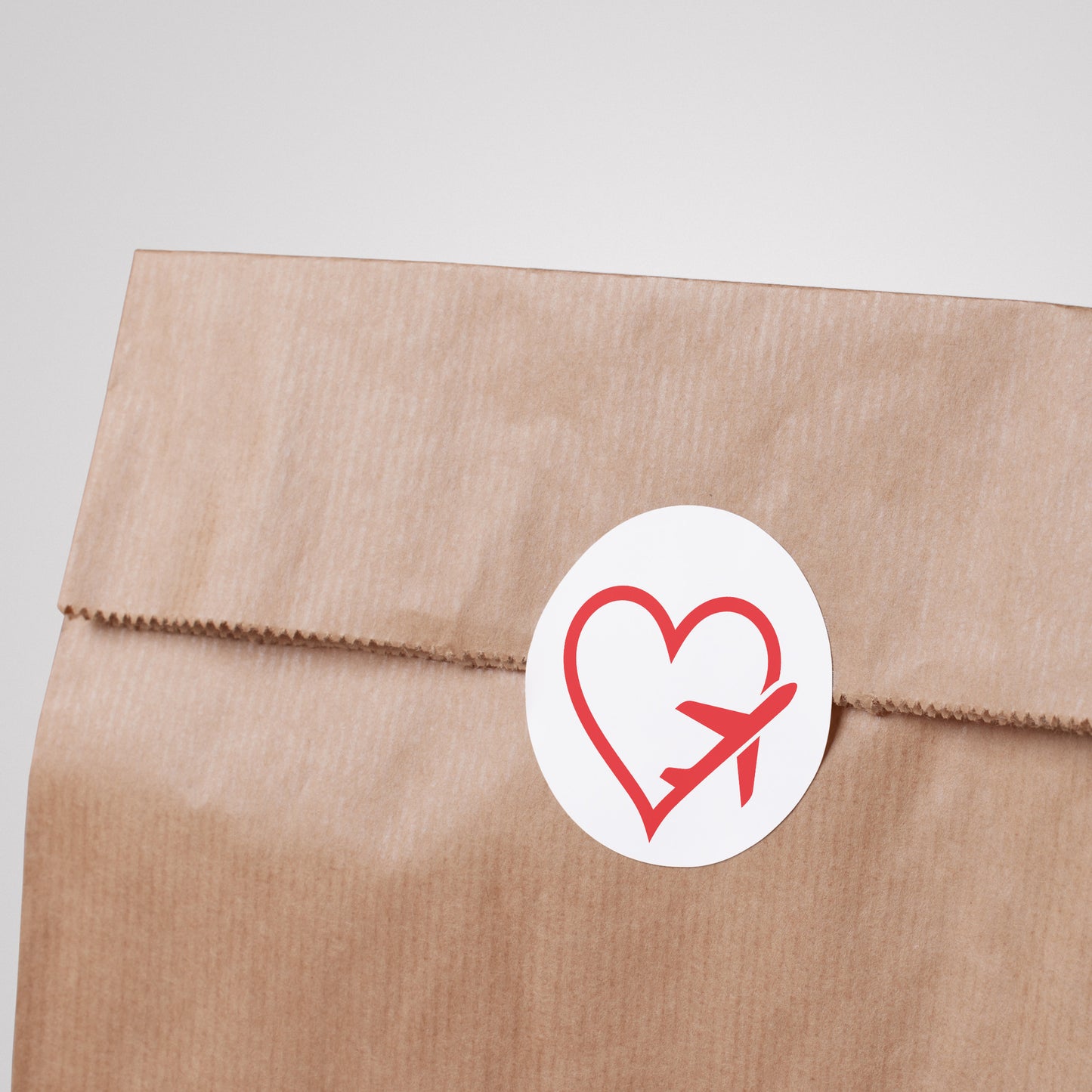 Explore your passion for travel with this heart and plane design