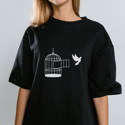 Freedom of flight with a bird and an open cage