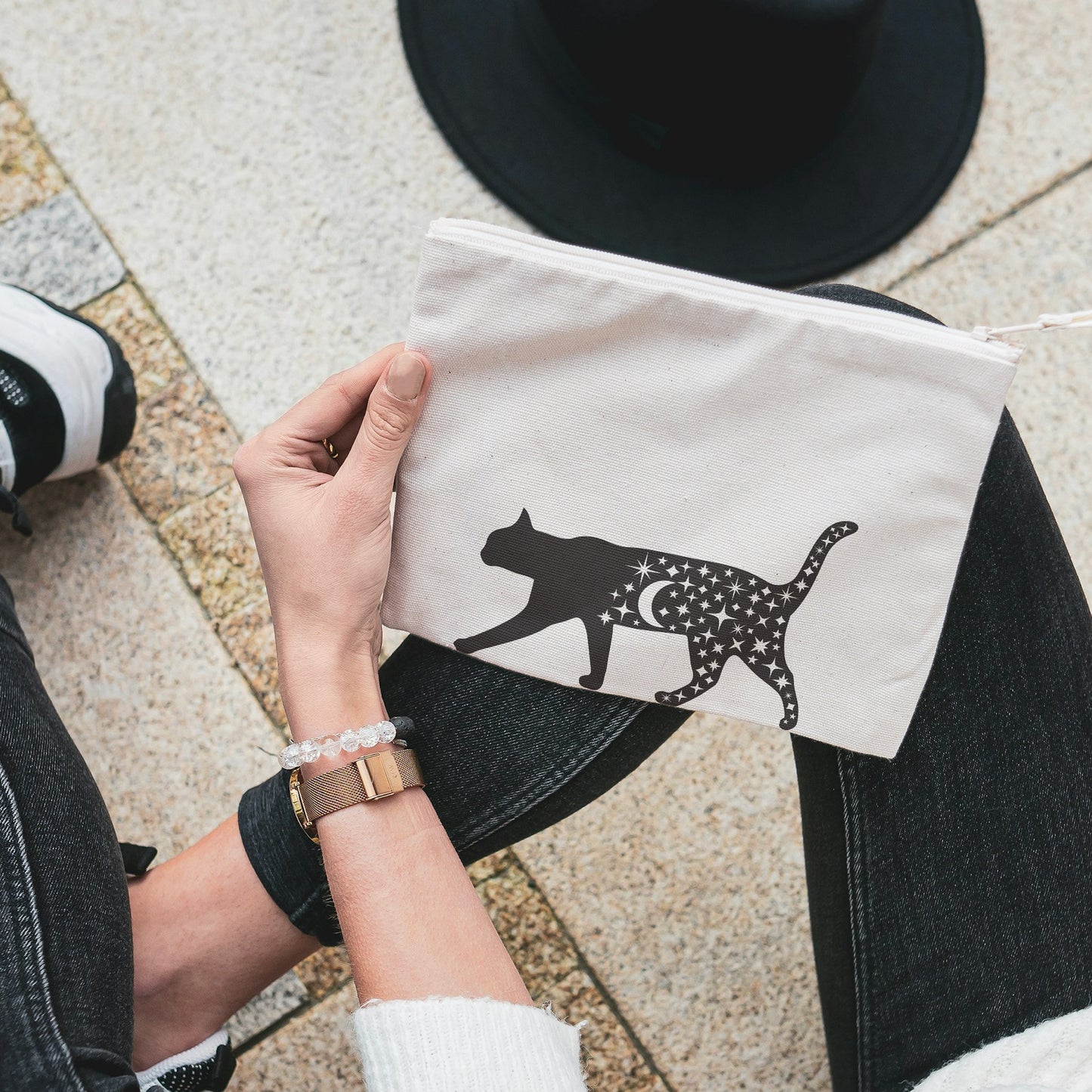 Magical black cat silhouette with stars and crescent moon