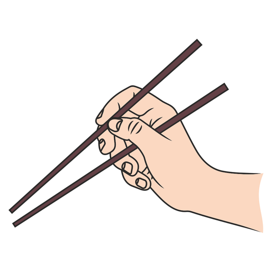 Hand skillfully holding chopsticks for a traditional meal