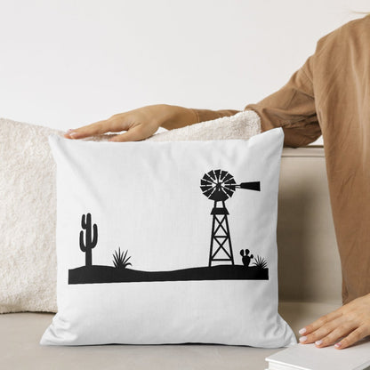 Desert scene with a silhouetted windmill