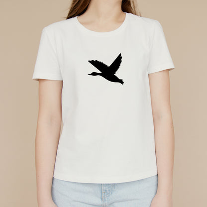 Elegant black silhouette of a soaring bird in flight