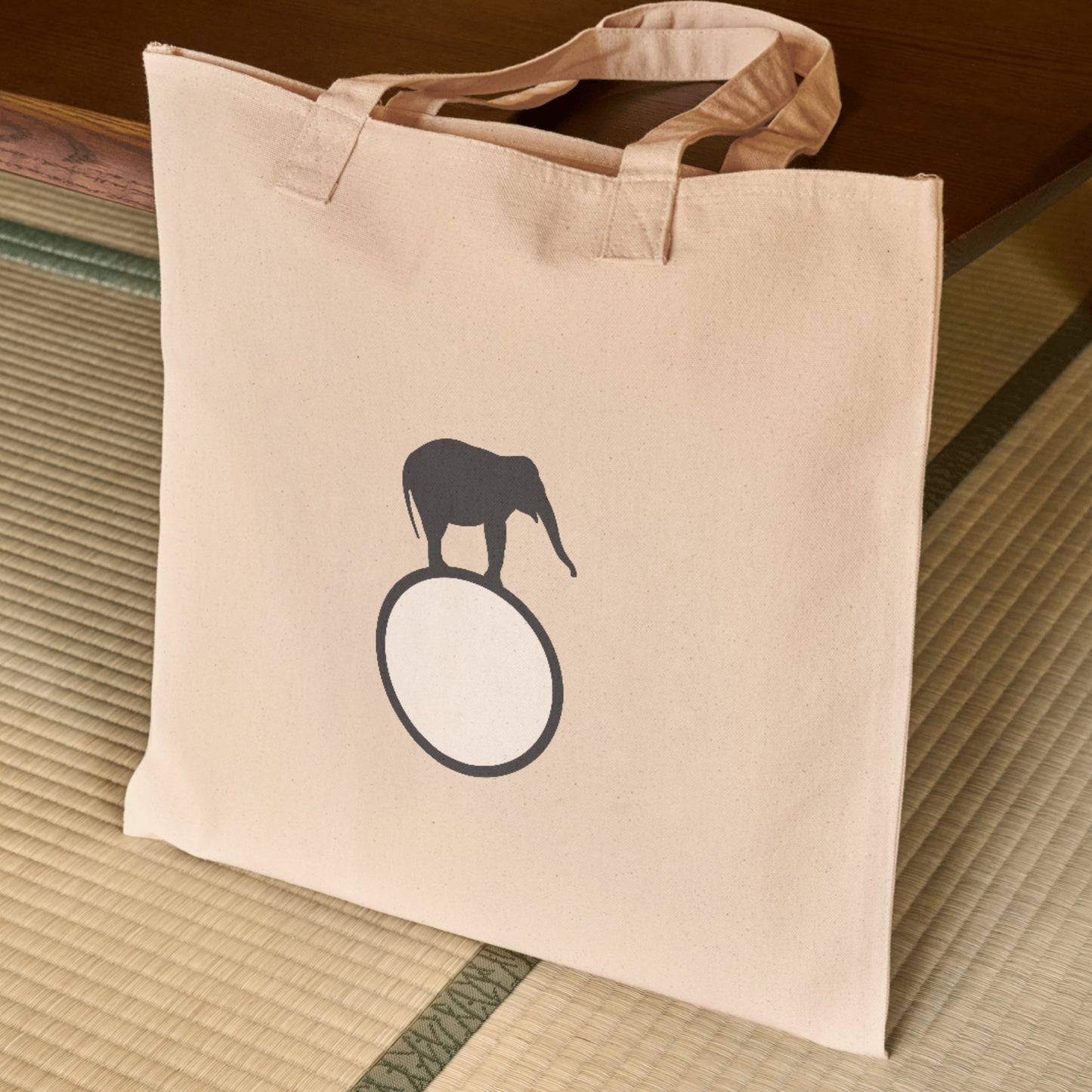 Elephant balancing on a circular hoop for creative projects