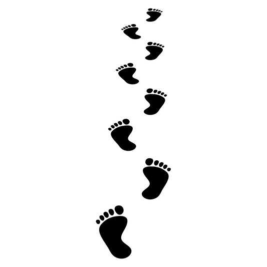 Unique footprints in the sandy shore for creative projects