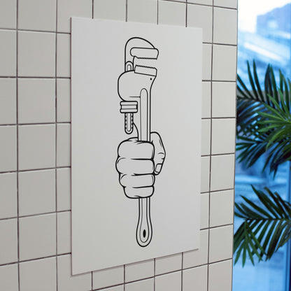 Hand gripping a wrench for the cutting machine craft