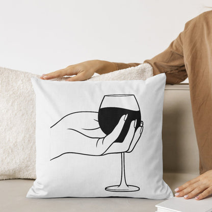 Elegant hand holding glass of red wine for cutting designs