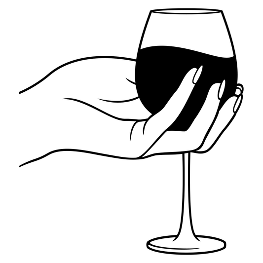 Elegant hand holding glass of red wine for cutting designs