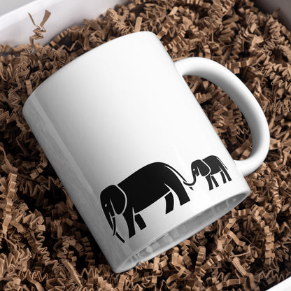 Mom and baby elephants walking together in a joyful moment