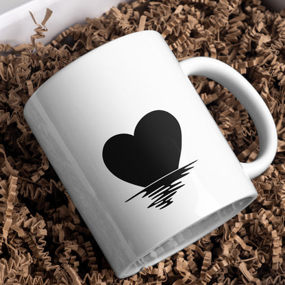 Sunset heart silhouette with reflection in tranquil waters