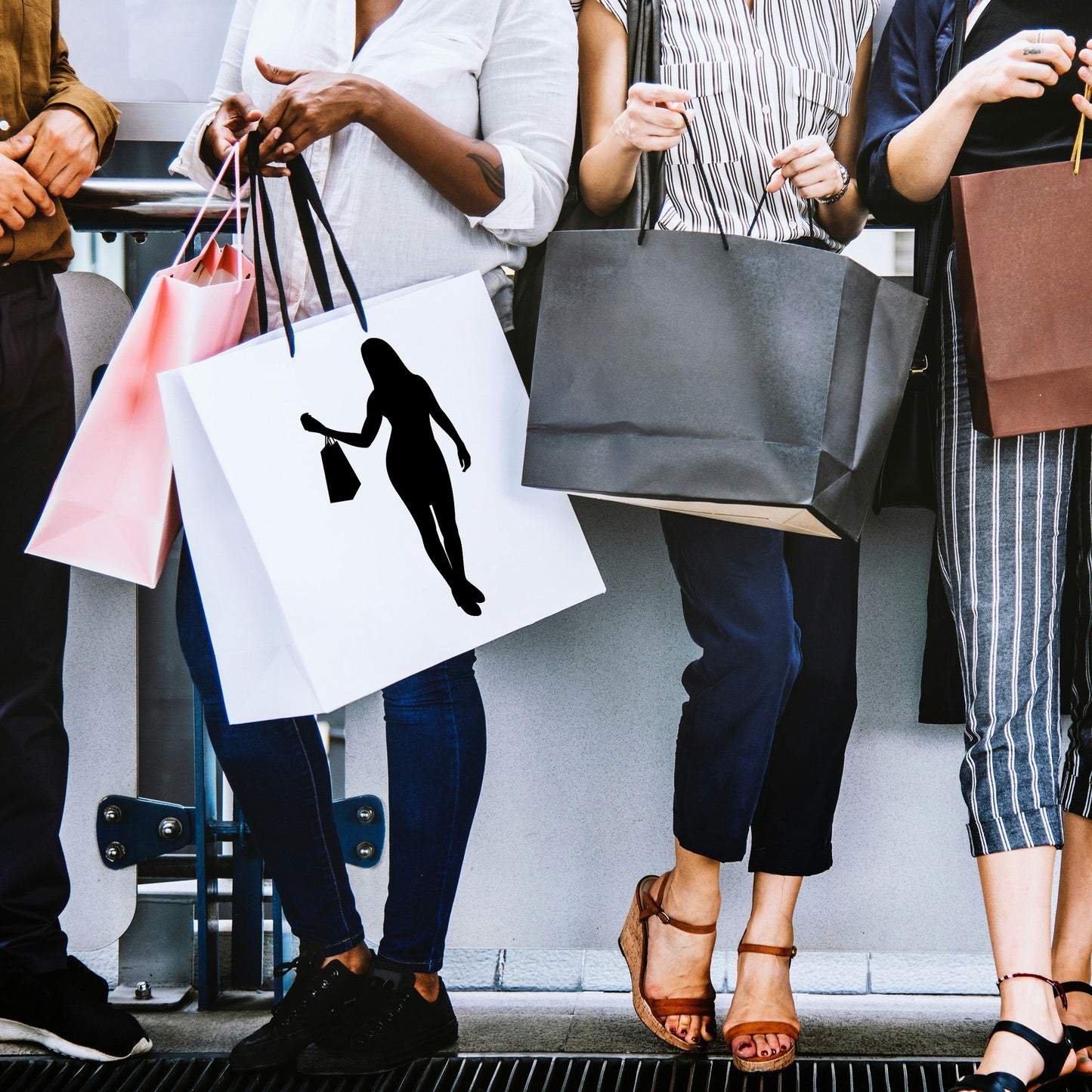 Woman's silhouette striking a stylish shopping pose